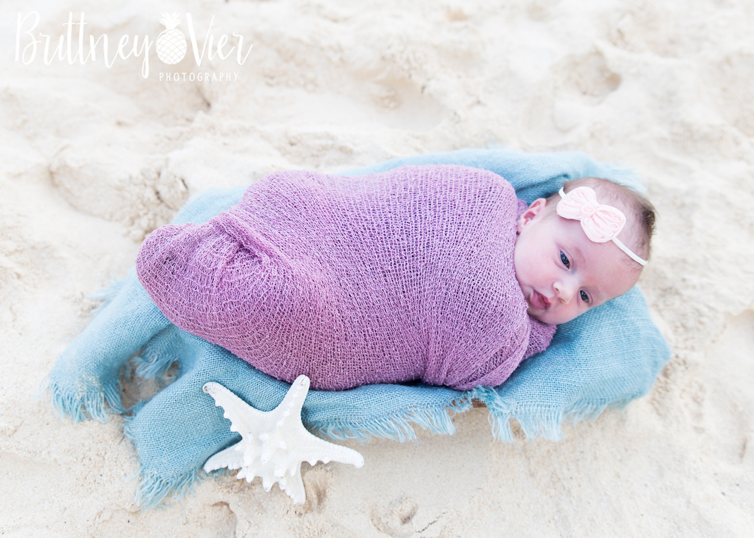 Oahu newborn photographer | newborn beach pose
